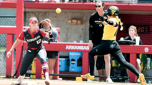 Arkansas first baseman Cylie Halvorson makes the play at first for an out against the Oregon Ducks.